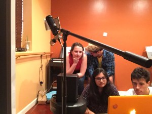 Fleetwood Snack gathered around the computer editing the final take of "Gold Crust Woman"